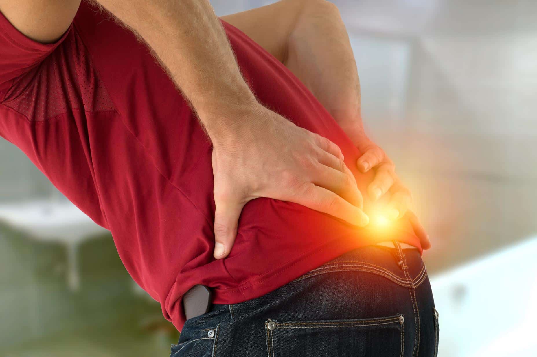 Health problem concept man suffering lower back pain.